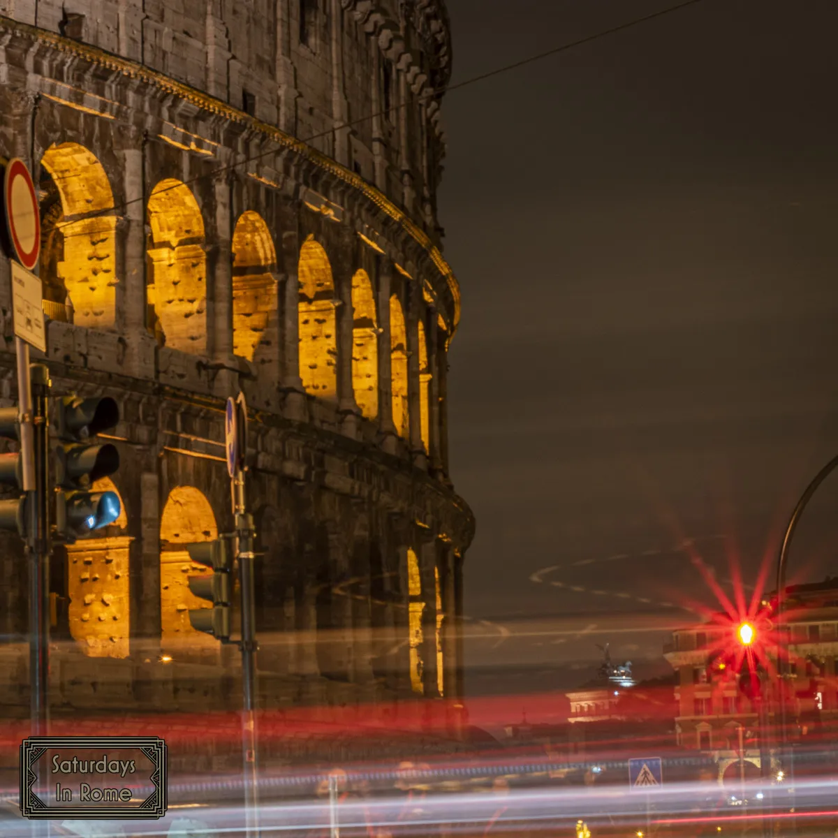 Cars Zipping By The Colosseum At Night